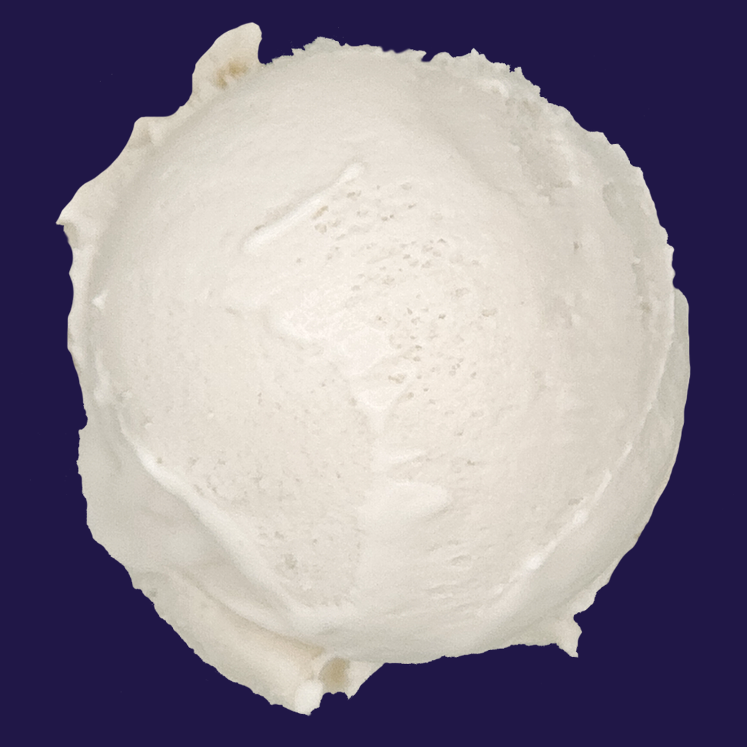 a scoop of Coconut Pandan sorbet against a dark navy background