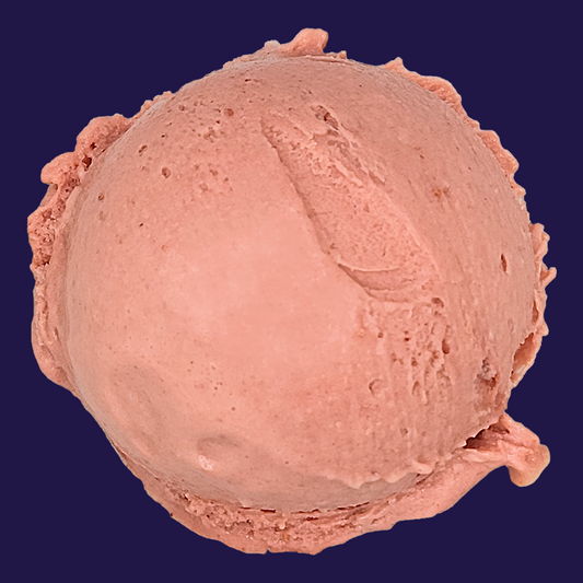 a scoop of Strawberry Basil non-dairy gelato against a dark navy background